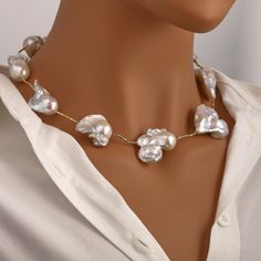 ----------Details Description---------- Material: Pearl Shape:  Irregular ( As Pictured ) Color: As picture( Jewelry may have slight color variations, which are considered normal ) Necklace Size:18inches Quantity:1pcs Weight: Approx.77g This stylish short necklace showcases baroque-style imitation pearls with a glossy white finish, paired with geometric beading for a modern twist. Designed with an adjustable length and a convenient magnet clasp, it ensures easy wear and a comfortable fit. Perfect for parties, special occasions, or everyday chic, this versatile piece enhances your outfit with timeless elegance and contemporary flair. A thoughtful gift for women who love distinctive and fashionable jewelry. ★Shopping Tips★: Please note that due to the unique nature of natural crystals, each