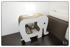 an elephant shaped book shelf with books in it