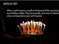 a birthday cake with lit candles on it and the words witch tip written in white