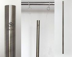 three different types of stainless steel items in various positions and sizes, including one pole with the letter g on it