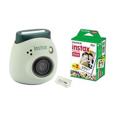 the instax mini camera is next to its box