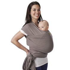 a woman holding a baby wrapped in a grey wrap on her back and smiling at the camera