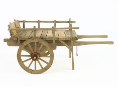 an old wooden wagon with sheep on the front and back wheels, sitting upright against a white background