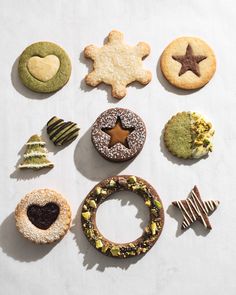 various cookies and pastries arranged in the shape of a star, heart, tree, snowflake