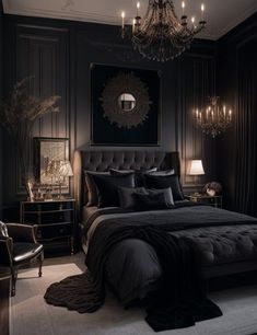 a black bedroom with chandelier, bed and chair in the middle of it