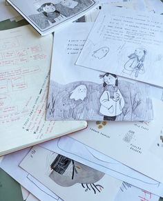 a pile of papers with drawings on them