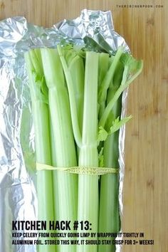 green celery wrapped in aluminum foil on a wooden table with the words kitchen hack 13