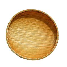 a round woven basket on a white background