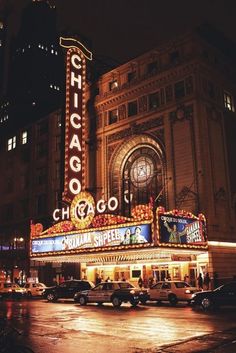 the chicago theatre is lit up at night