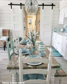 a dining room table with plates and place settings