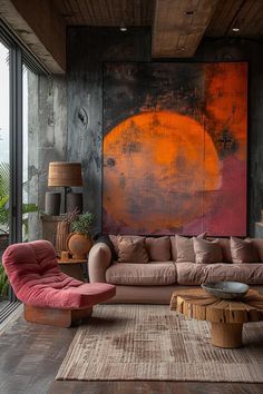 a living room filled with furniture and a large painting on the wall above it's windows