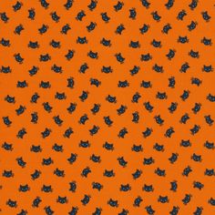 an orange background with black cats on it