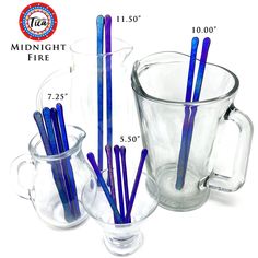 the measuring cup is filled with blue drinking straws and has two cups next to it