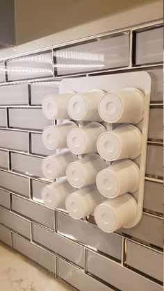 several rolls of toilet paper are hanging on the wall