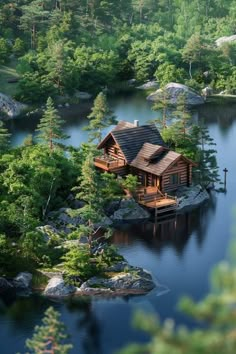 a house on an island in the middle of a lake surrounded by trees and rocks