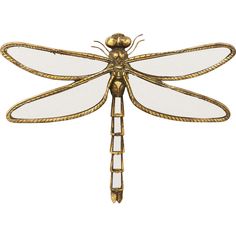 a gold dragonfly sitting on top of a white surface