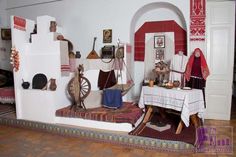 a room filled with lots of different types of items on display in front of a doorway