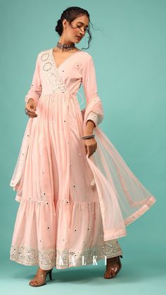 Walk down with elegance and class in our royal pearl pink anarkali kurta in lucknowi style floral embroidery. The kurta is fabricated in cotton with a net dupatta. The kurta comes in an angarakha pattern cut with peplum style and a frill at the bottom. The kurta comes in a V neckline with angarakha pattern closure and tassel doris. Lucknowi Embroidery