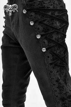 The Louis Pants Ornate and stylish, Vampire style slim-fit trousers with uniquely embellished and velvet laced side panels, plus an ornamental buckle on the back. A subtle, all-over crest pattern adds a dark Victorian vibe.. Material: Cotton/Spandex Blend. Fitted with a slight stretch. Size S M L XL 2XL 3XL 4XL Waist 33.1" (84cm) 35.0" (89cm) 37.0" (94cm) 38.9" (99cm) 40.9" (104cm) 42.9" (109cm) 44.9" (114cm) Length 42.5" (108cm) 42.7" (108.5cm) 42.9" (109cm) 43.1" (109.5cm) 43.3" (110cm) 43.5" Victorian Pants, Gothic Suit, Vampire Style, Dark Victorian, Victorian Men, Vampire Clothes, Pants Elegant, Gothic Pants, Alt Outfits