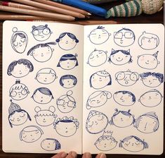 an open notebook with people drawn on it