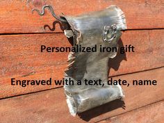 a metal object with the words personalized iron gift engraved with a text, date, name