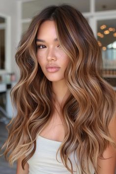 37 Stunning Caramel Brown Hair Ideas to Sweeten Your Look Brown Blonde Caramel Hair, Honey Highlights On Auburn Hair, Hair Colour Caramel Brown, Long Caramel Balayage, Copper Hair Honey Highlights, Bronde Balayage With Copper Tones, Light Chocolate Brown Hair Highlights, Copper Chestnut Hair Color, Skin Color Hair Color Chart