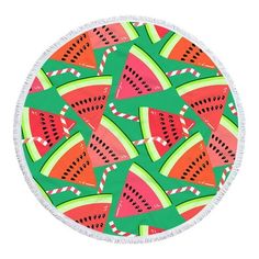 a round beach towel with watermelon slices on it