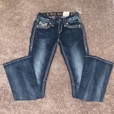 *Nwt* Never Worn Boot Cut 25/32 (Says Tall But Im Almost 5'3 And The Length Is Perfect ) They Dont Make This Exact Pair Anymore They Are Stunning!! Rare Find And Good Deal! Buy It While Its Still For Sale' Y2k Style Dark Wash Mid-rise Flare Jeans, Low Rise Jeans Outfit 2000s, Buckle Store, Y2k Dark Wash Flare Jeans, Rock Revival Jeans Outfit Y2k, Rock Revival Low Rise Jeans, Rock Revival Jeans Women, 2000s Clothing, Buckle Jeans