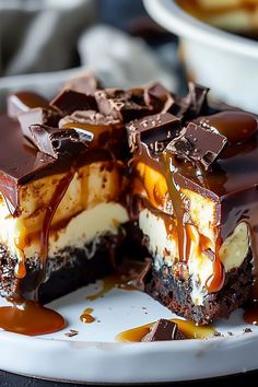 a piece of chocolate cheesecake with caramel sauce on the top and one slice cut out