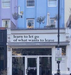 a building with a sign that says learn to let go of what wants to leave