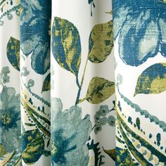 blue and yellow floral curtains with green leaves on them