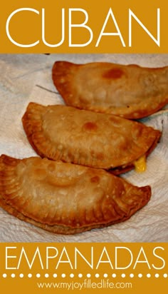 some food that is sitting on top of a paper towel with the words cuban empanadas