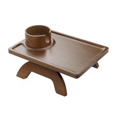 a wooden tray with a cup on it