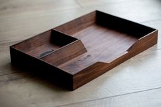 an empty wooden tray on the floor