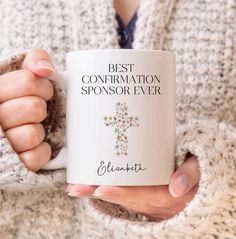 a woman holding a coffee mug with the words best contrition sponsor ever on it