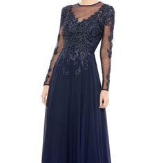 Designer: Mac Duggal Size: 8 Condition: New With Tags Originally $698.00!!! Sparkling Scroll Work Decorates Captivating Illusion Lace Detailing A Midnight-Blue Gown Designed In A Beloved A-Line Silhouette. Jewel Neck Long Sleeves Lined 100% Polyester The Manuf Tag Is Missing..The Dept Store Tag Is Attached Midnight Blue Gown, Flowy Gown, Mac Duggal Dress, Cap Sleeve Gown, Sequin Evening Gowns, Drape Gowns, Mac Duggal Dresses, Formal Dresses With Sleeves, Scroll Work