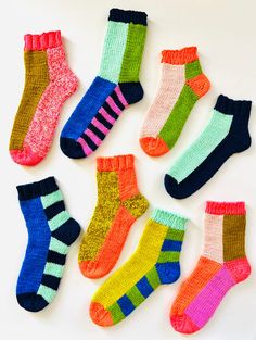 six pairs of socks with different colors on them