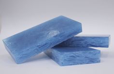 three blue soap bars stacked on top of each other