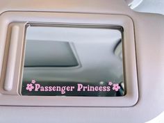 the passenger princess sticker is on the back seat of a car with pink flowers