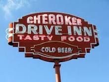 a sign for a fast food restaurant called cheetoker drive - in tasty food