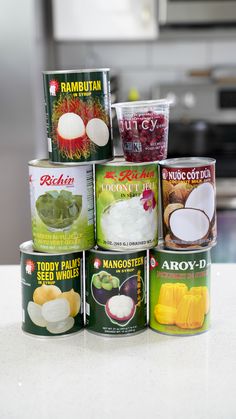 several cans of food are stacked on top of each other