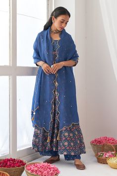 Blue floral print anrakali with hand embroidered detail. Paired with embroidered hem pant and dupatta with tassels.
Component: 3
Pattern: Hand embroidered, Printed
Type Of Work: Mirror work, Digital print
Neckline: Square
Sleeve Type: Three quarter
Fabric: Cotton silk, Organza
Color: Blue
Other Details: 
Scallop dupatta
Hand embroidered mirror tassels
Note: Basket held by the model is not for sale
Occasion: Mehendi, Reception - Aza Fashions Printed Anarkali, Silk Peonies, Peony Print, Anarkali Kurta, Blue Mirror, Dupatta Set, How To Hem Pants, Organza Dupatta, Blue Hand