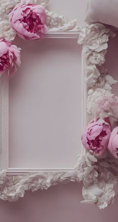 pink peonies are arranged around a white frame