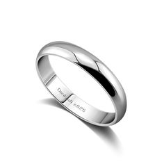 a white gold wedding ring on a white background with the word,'love is in the air '