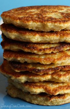 a stack of pancakes sitting on top of a blue plate