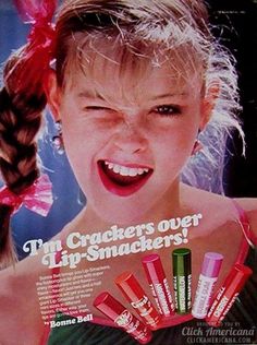 an ad for lip smackers on the floor in front of a woman's face