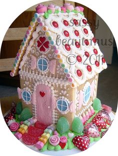 a gingerbread house decorated with candy and candies for the season of beautiful 2012