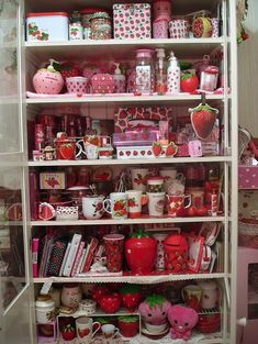 a shelf filled with lots of different types of food and decor on top of each other