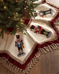 a christmas tree skirt with nutcrackers on it