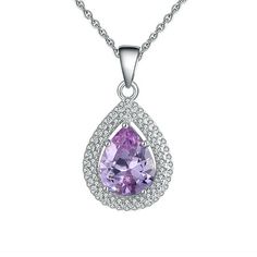 The Halo Lavender Purple Oval 3CTW Teardrop Sterling Silver Pave CZ Chain Pendant Necklace from the Ginger Lyne Collection is a testament to timeless beauty and contemporary design. This exquisite piece features a 10x8mm main stone of light purple Cubic Zirconia, reminiscent of the tranquil hues of a lavender field at dusk. The stone is perfectly framed by a halo of clear CZ stones, enhancing the pendant's overall brilliance and size of 23mm by 13mm. Crafted from high-quality .925 Sterling Silve Lavender Field, Teardrop Pendant, Lavender Purple, Chain Pendant, Cz Stone, Necklace For Women, Chain Pendants, Celebration Of Life, Light Purple